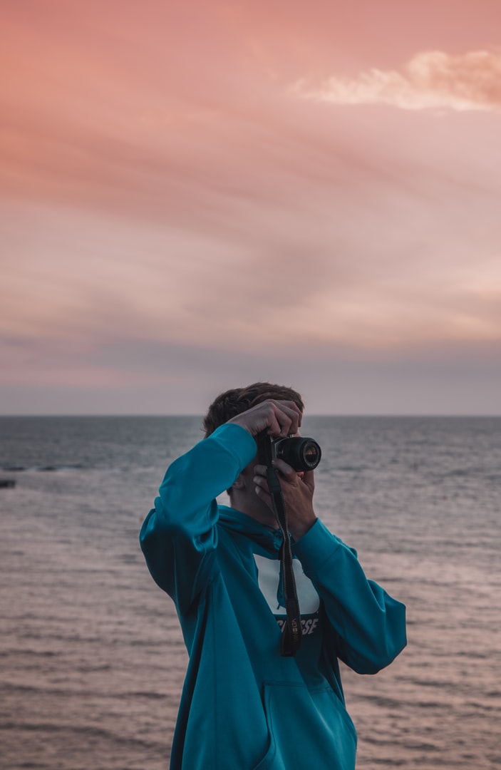 Man taking photo on beach